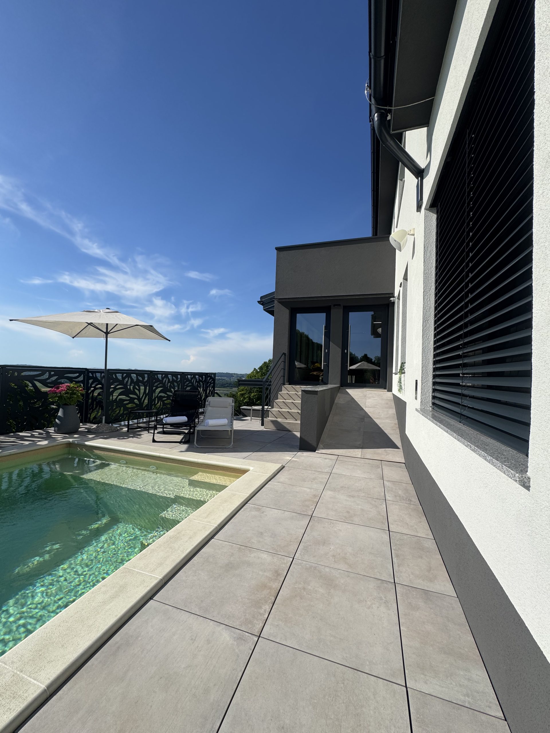 Outdoor ramp connecting the terrace and pool area